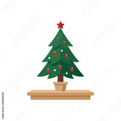 A small decorated Christmas tree sits on a wooden shelf