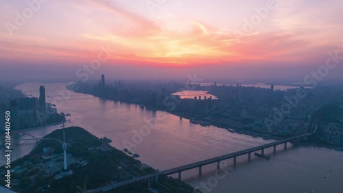 Aerial Timelapse Panorama of Wuhan City Skyline at Sunrise, Yangtze River and Wuhan Yangtze River Bridge at Dawn, Hubei China
