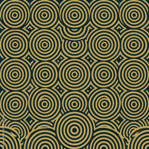 Seamless geometric pattern of golden concentric circles on blue