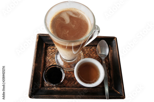 Top view of Iced latte coffee and hot black coffee with tea in a woven tray