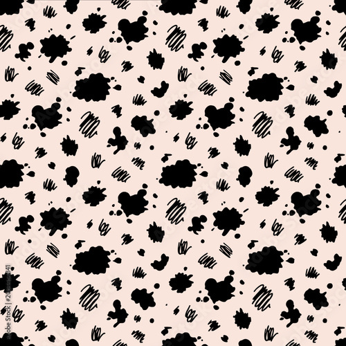 Seamless pattern with black ink splatters on a pink background