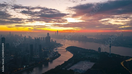 Aerial Timelapse Panorama of Wuhan City Skyline at Sunrise, Yangtze River and Wuhan Yangtze River Bridge at Dawn, Hubei China