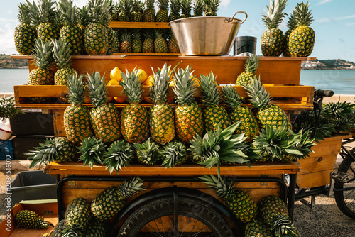 Photography Fresh pineapples on food cart in Lisboa Portugal