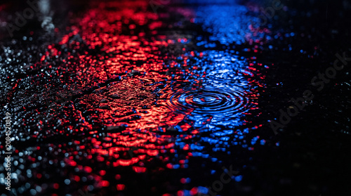 Police Sirens Red and Blue Light Reflections on Wet Asphalt During Rain at Night