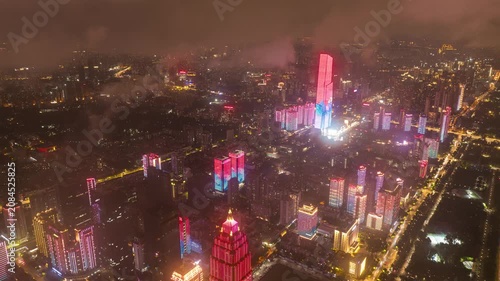 Aerial Timelapse of Wuhan Central Business District Night Cityscape, Skyscrapers Illuminated With Floating Clouds Over Wuhan Downtown, Hubei China
