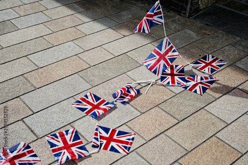 Union Jack British flags on ground after far right protest against illegal immigration in London