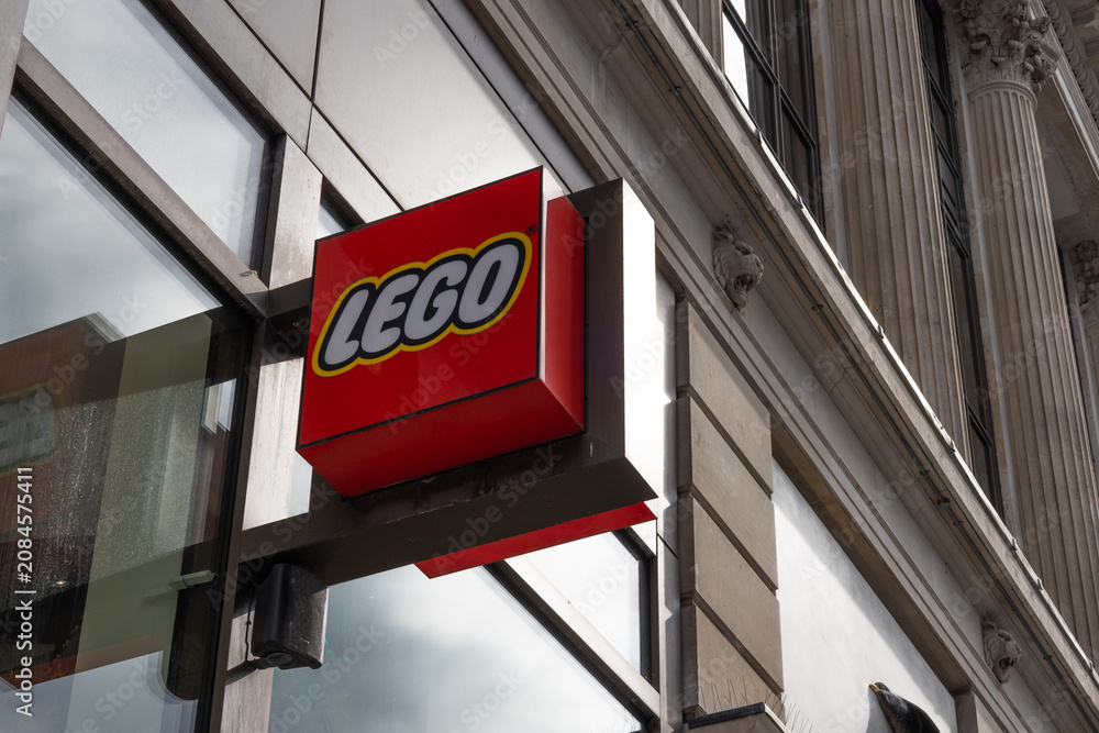 Obraz premium Lego store sign on a classic city building facade. London, UK, 16 July 2023
