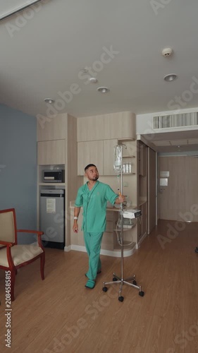 Male patient resting and recovering in a modern hospital room with IV drip, medical bed, and healthcare equipment, representing treatment, recovery, and medical care.