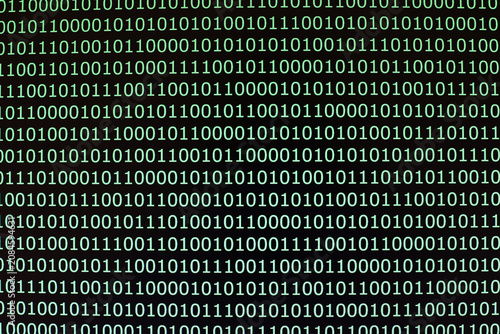 Fotografie Green binary code fills black computer screen