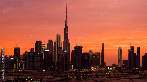 Burj khalifa and dubai cityscape during vibrant sunset