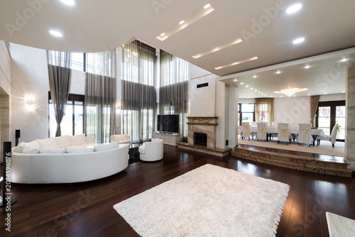 Luxury Modern Living Room Interior with Floor-to-Ceiling Windows, White Furniture and Open Concept Design