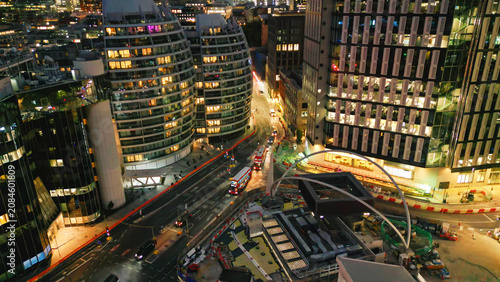 London night cityscape featuring traffic and illuminated skyscrapers