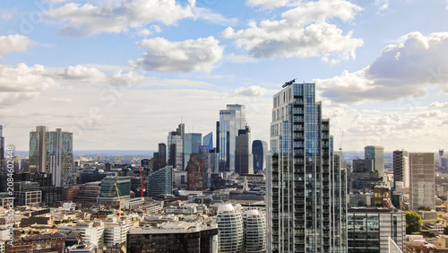 London city skyline featuring modern skyscrapers under clouds