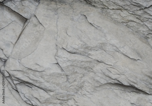 Natural grey stone texture with split face and rugged rock layers.
