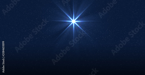 The birth of Christ, Christmas star of the Nativity of Bethlehem, Nativity of Jesus Christ. Background of the beautiful dark blue starry sky and bright star.