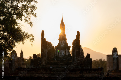 Cuadro en lienzo Ancient Buddha statue at Sukhothai Historical Park during sunset, Thailand
