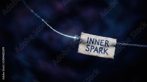 Inner spark glowing on a tag against a dark void