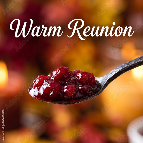 Closeup of a spoonful of homemade cranberry sauce with a blurred autumn background