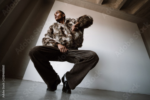 Model Poses in Urban Setting With Unique Outfit and Strong Stance