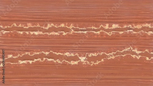 Foto Terracotta rammed earth texture with distinct wavy sediment layer