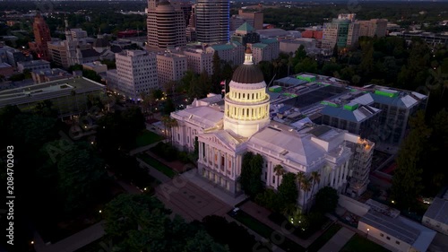 Explore aerial views of California State Capitol in Sacramento at night showing the historic building and ongoing annex construction.