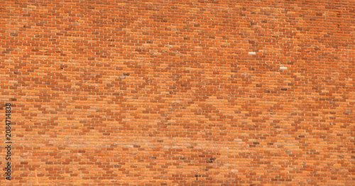 Tableau sur toile Rear view perspective of a historic downtown red brick building facade facing a commercial back alley lot showing architecture masonry texture from nineteenth century
