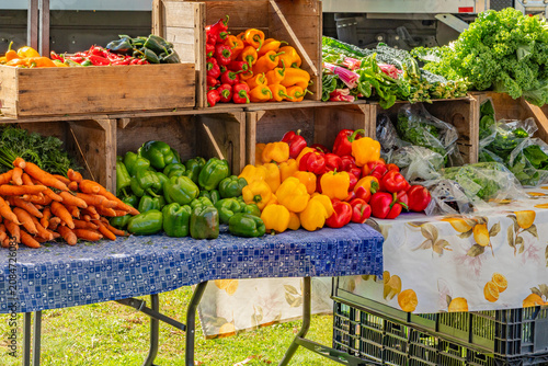 Fresh vegetables on display at a local farmer's market in summer.