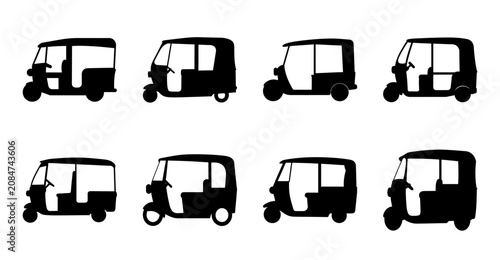 Black auto rickshaws in a row - A clean set of black silhouette-style auto rickshaws aligned neatly in a row, ready for stock use.