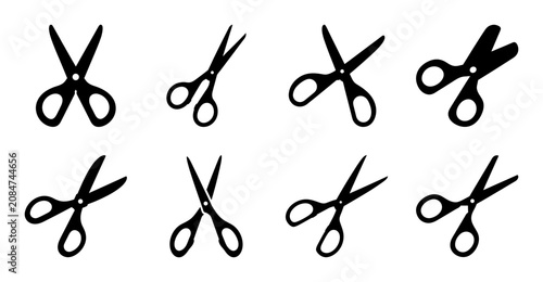 Foto Black scissors icon set in various angles - A clean set of black scissors icons displayed in different orientations and open positions, ideal for design and editorial use