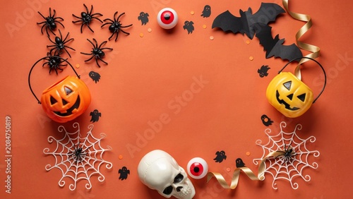 Halloween decorations flat lay with spiders bats and jack o' lanterns
