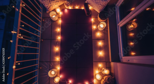 Serene Evening Yoga Mat Illuminated By Fairy Lights And Candles On A Balcony