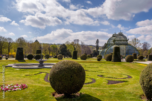 фотографія Historic Palm House Greenhouse in Formal Spring Garden, Vienna Austria