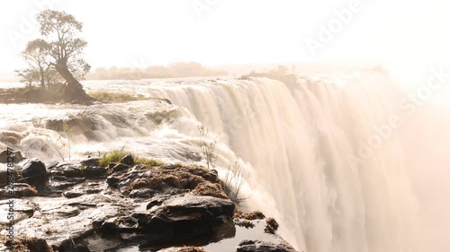 The Zambezi River from the Zambian side, rushing toward the edge of Victoria Falls, Zambia, Africa