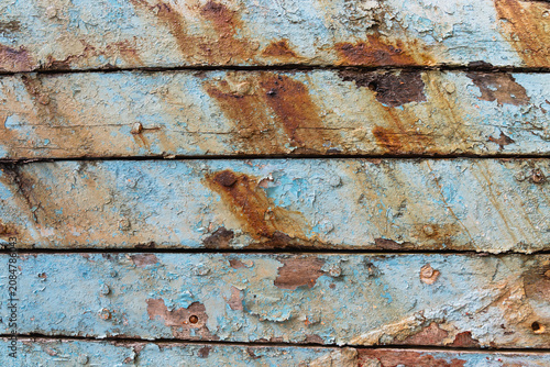 Texture of Weathered Boat Wood with Peeling Blue Paint