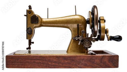 Tableau sur toile Isolated antique brass sewing machine on a wooden base with vintage craftsmanshi