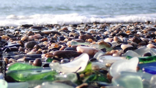 Sea glass, Pieces of sea glass isolated on white background, Green pieces of glass polished by the sea closeup background. A pile of natural beach glass, Multi colored pieces of polished glass. Colore