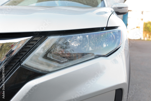 Close-up View of Silver Car Headlight