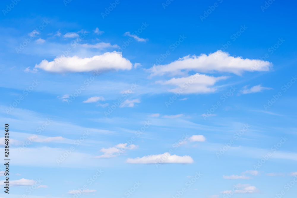 Fototapeta premium few small cirrus and cumulus clouds in blue sky