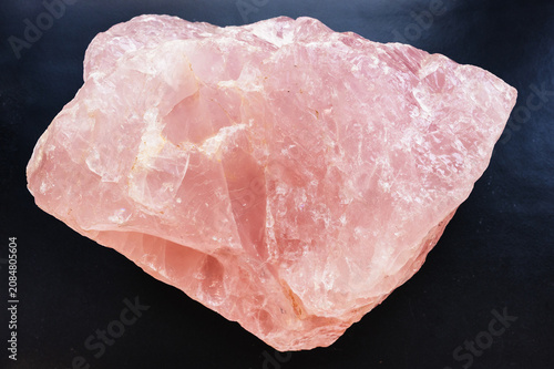 natural rose quartz rock close-up on black