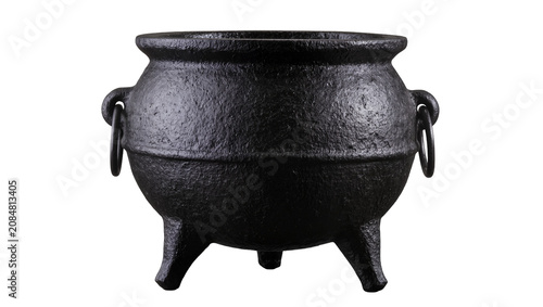 Isolated black cast iron cauldron with three legs, vintage rustic cooking pot or witch item