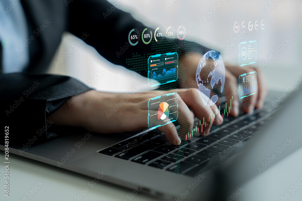Fototapeta premium Business professional using laptop to analyze data with digital interfaces showing charts and global information, reflecting modern technology and finance analysis. Sentient.