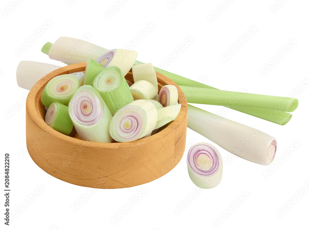 Fototapeta premium Fresh Lemongrass slices in wooden bowl isolated on white background with full depth of field