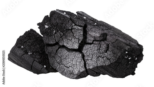 Foto Isolated natural charcoal chunk from burnt wood, dark black texture with cracks,