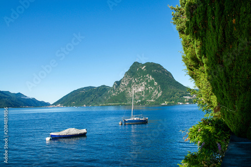Lake Lugano and Monte San Salvatore landscape from Villa Heleneum park