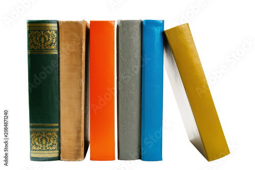 Fotografie Isolated row of diverse colorful book spines, some new and some antique, neatly