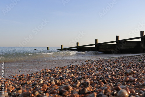 Canvastavla stone beach , surf, wooden breakwater