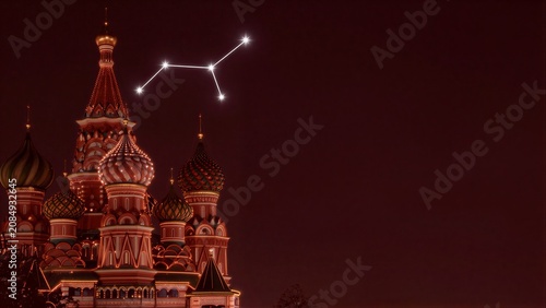 Illuminated St. Basil's Cathedral under a starry night sky, glowing domes against deep red heavens.