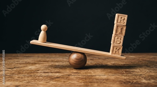 Wooden Balance Scale with Peg Doll Pawn and Risk Blocks on Wood Table