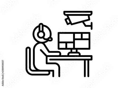 Person monitoring security cameras at desk