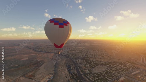 Circular aerial view at sunset of The Great Pyramids in Air Balloon Ride in Al Haram. Giza. Egypt